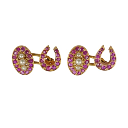 Pair of late 19th century ruby, pearl and gold cufflinks, English c.1890, with oval panel opposite horseshoe,